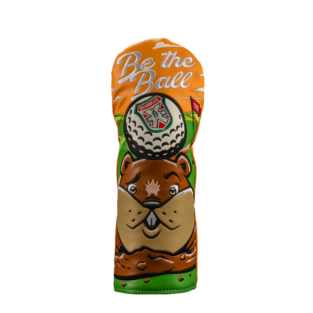 An official Caddyshack movie golf club fairway headcover featuring a cartoon gopher and a golf ball with the text 'Be the Ball'. The headcover has an orange top section, a brown beaver face, green grass details, and a white golf ball graphic in the center.