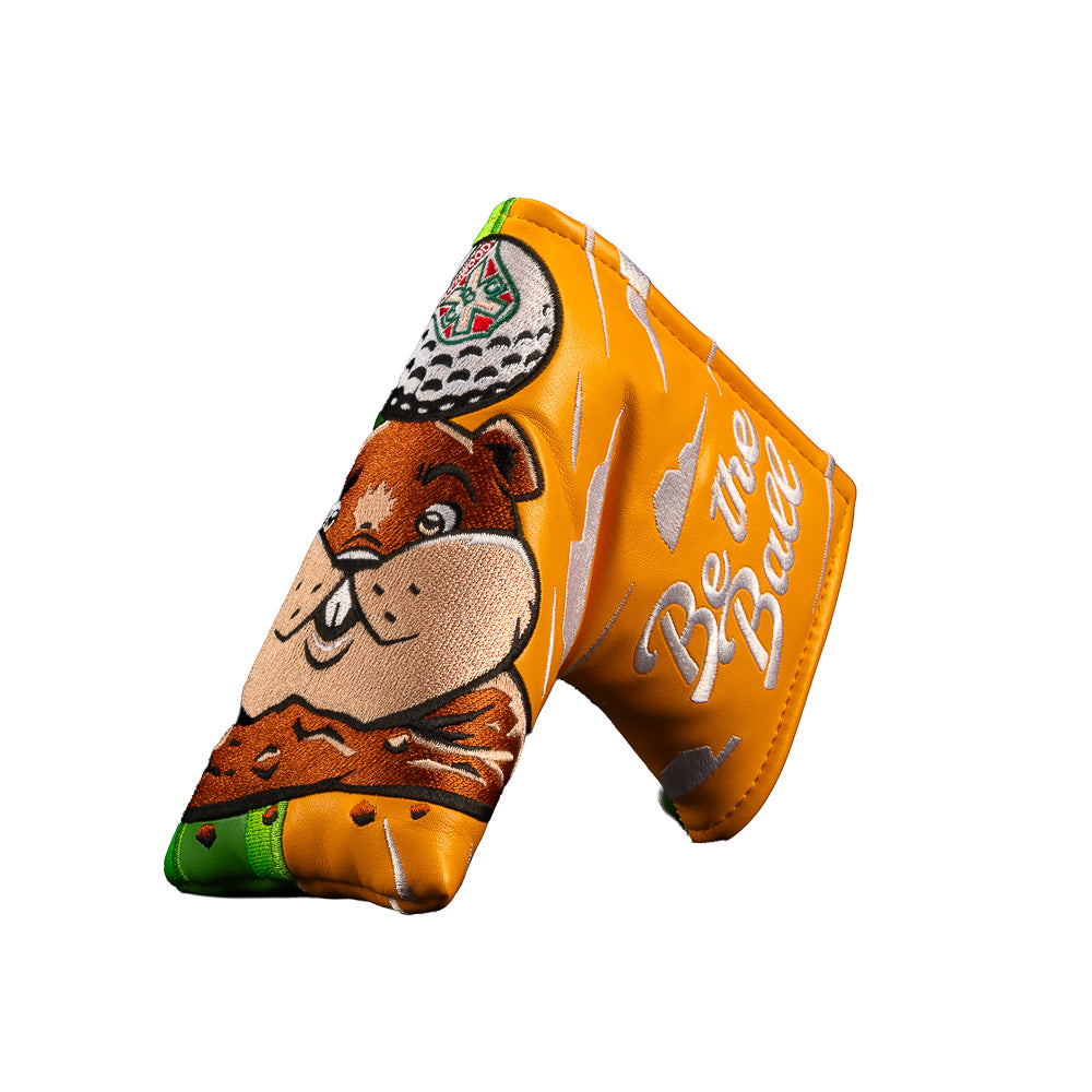 An orange Caddyshack official movie golf club headcover featuring a cartoon gopher illustration and the text 'Be the Ball' in white script, shown on a plain white background.