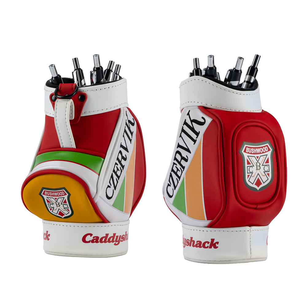 Rewind Golf Caddyshack Czervik Desk Caddy shown from two angles, featuring red and white panels, green and yellow accents, Bushwood crests, and pens in the top.