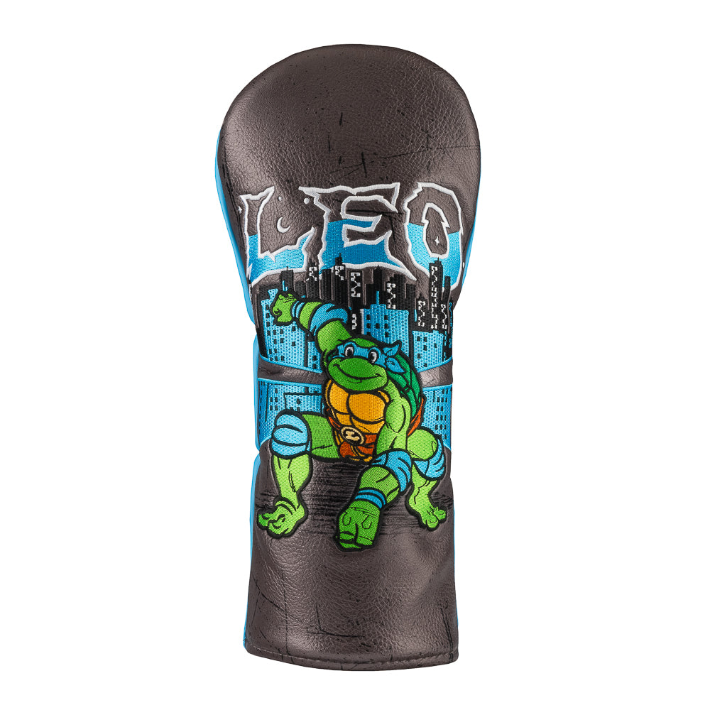 Blue TMNT Leo driver cover with swords and city backdrop.