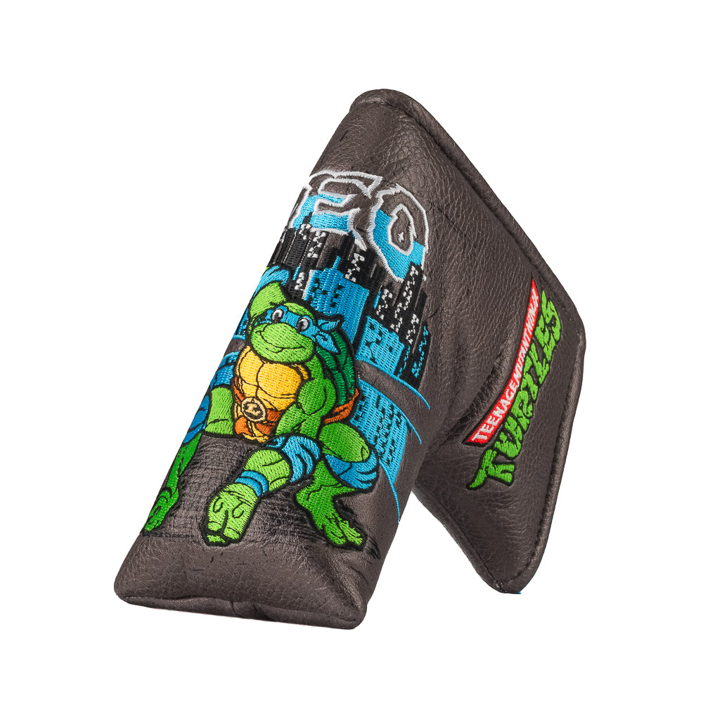 TMNT Leo blade putter cover with swords and blue cityscape detailing.