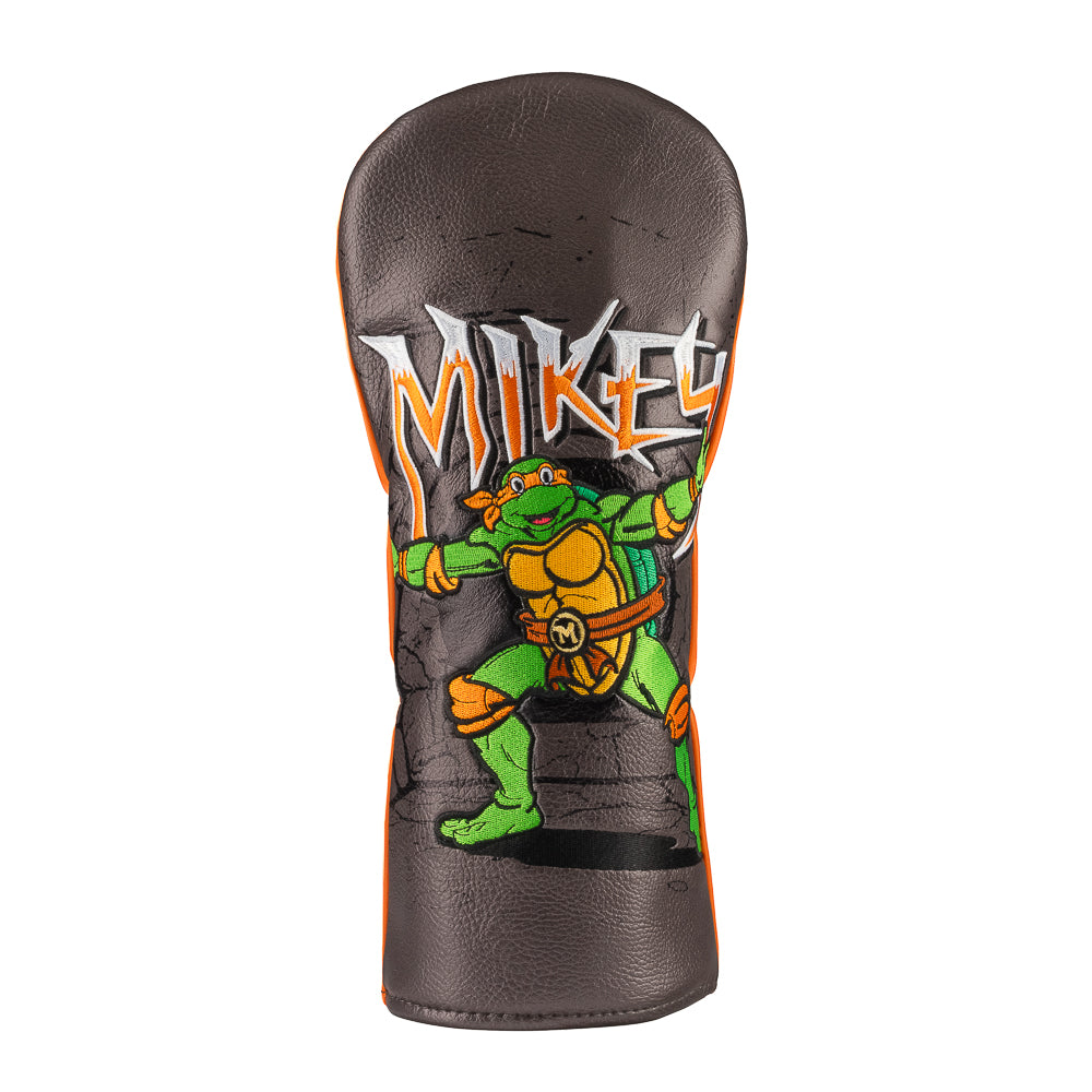 Orange TMNT Mikey driver cover with cartoon design.