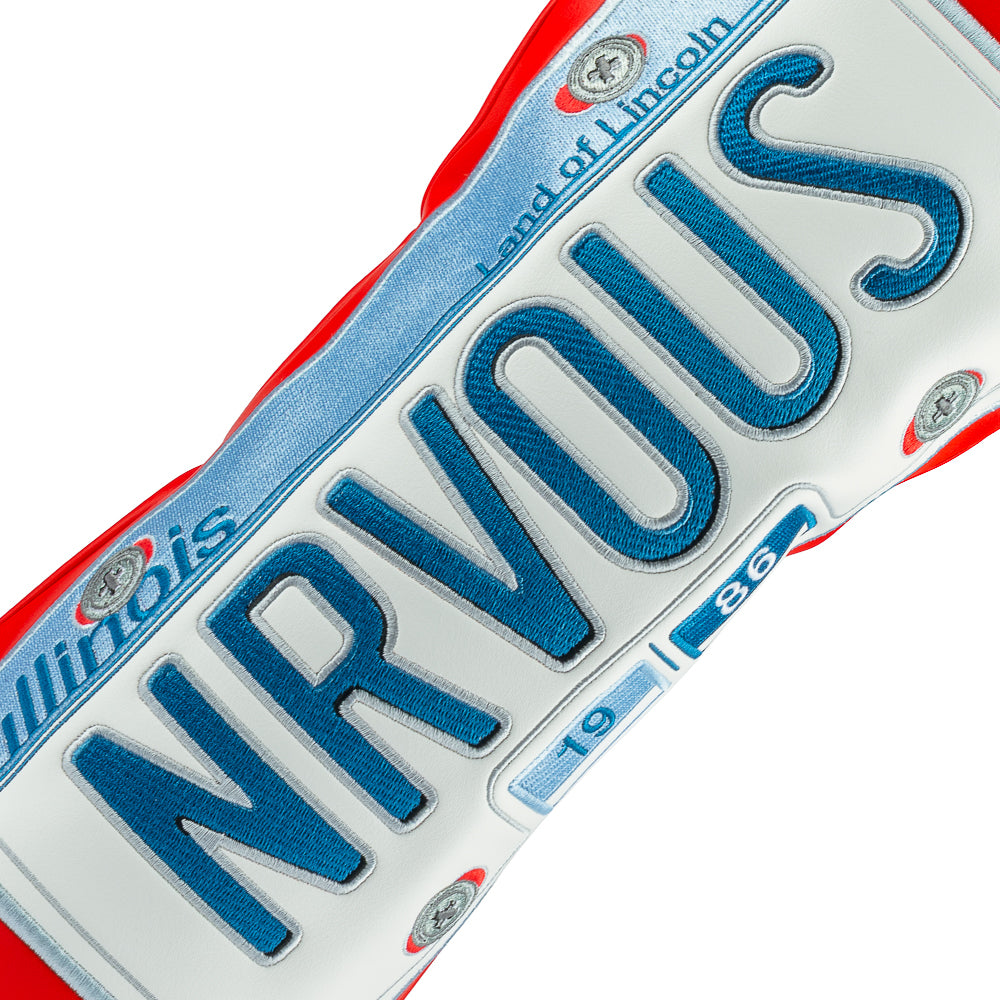 Rewind Golf x Ferris Bueller's Day Off official NRVOUS 1986 IL license plate on red material.