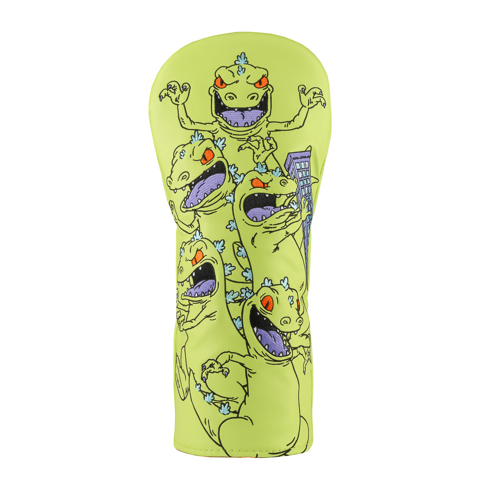 Green Rugrats Reptar driver cover with stacked cartoon Reptar design holding a building, bold Rewind Golf headcover style.