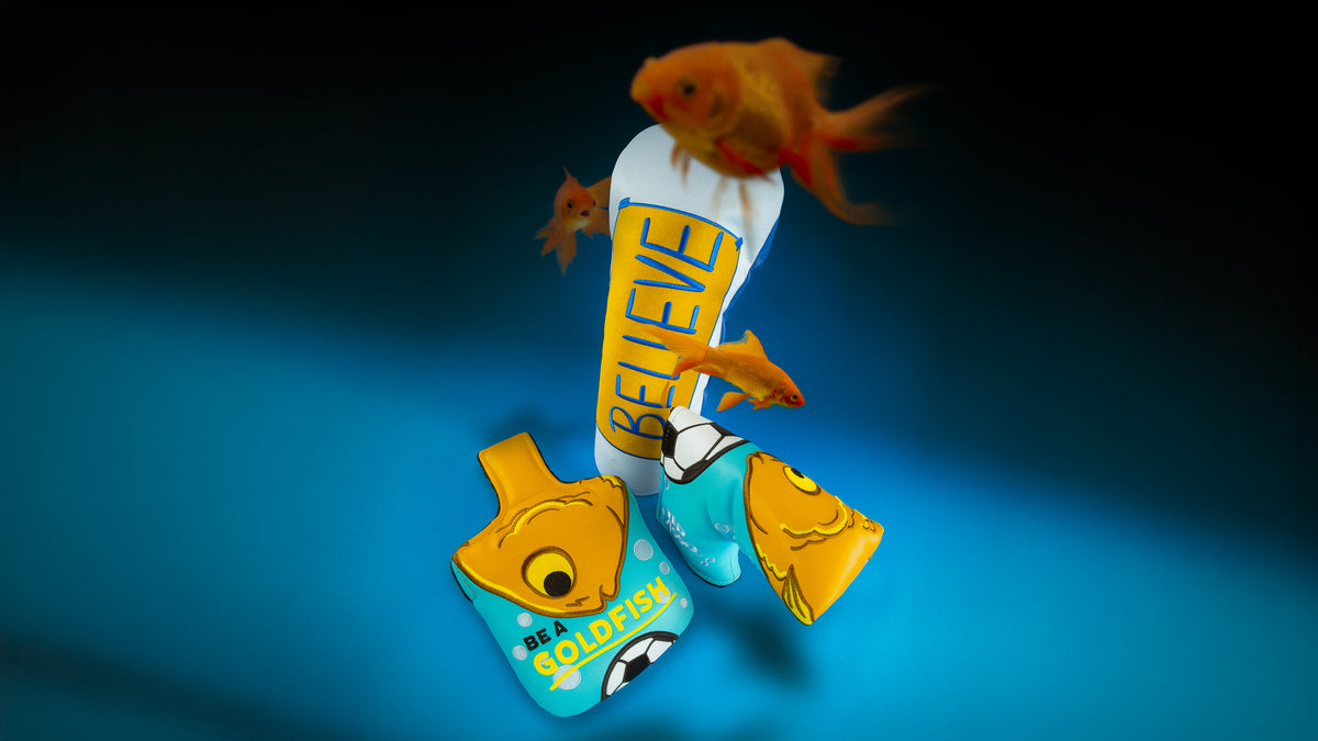 Rewind Golf x Ted Lasso official tv show themed golf headcovers featuring 'BELIEVE' and Be A Goldfish designs on blue background.